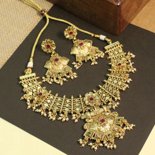 Polki-studded gold finish necklace set with traditional bridal design