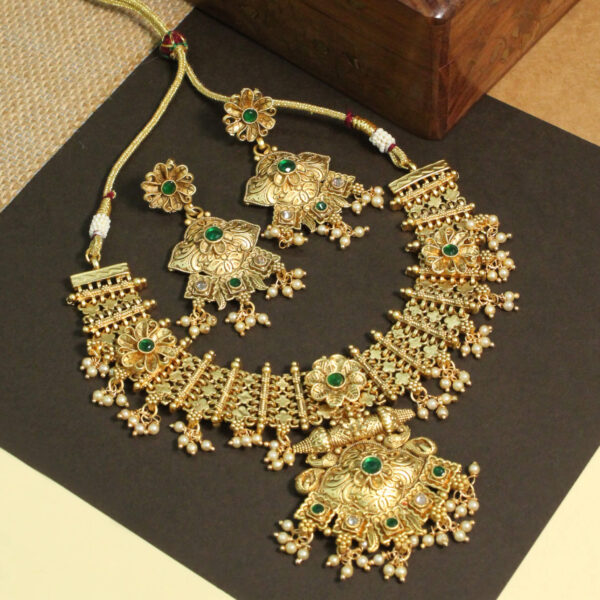 Polki-studded gold finish necklace set with traditional bridal design