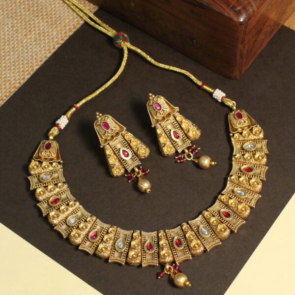 Polki-studded gold finish necklace set with traditional bridal design