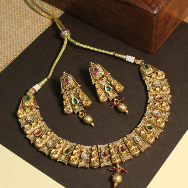 Polki-studded gold finish necklace set with traditional bridal design