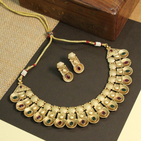 Polki-studded gold finish necklace set with traditional bridal design