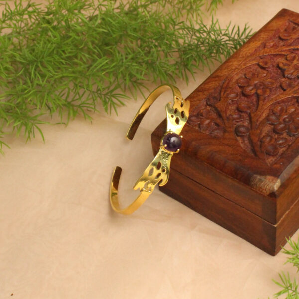 Gold polish bracelet studded with sparkling stones