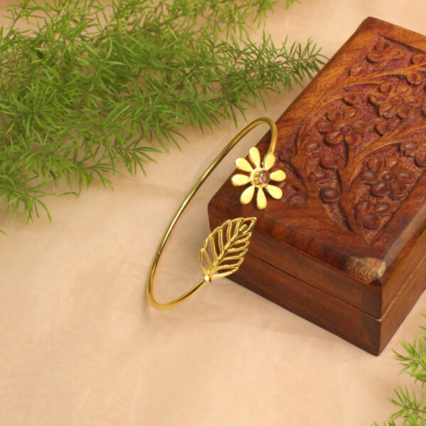 Gold polish bracelet studded with sparkling stones
