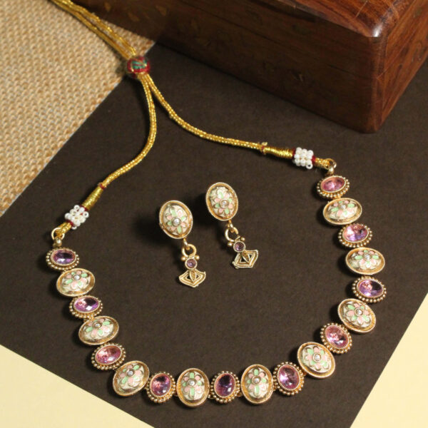 Polki-studded gold finish necklace set with traditional bridal design