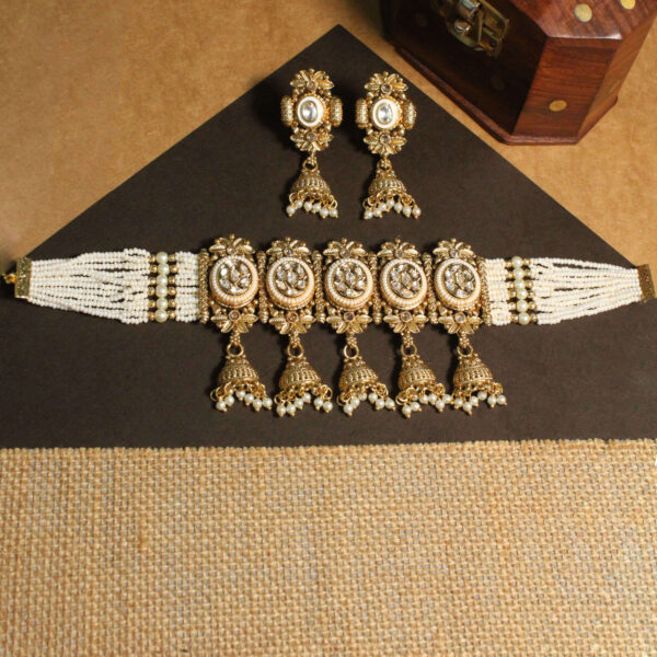 Polki-studded gold finish necklace set with traditional bridal design