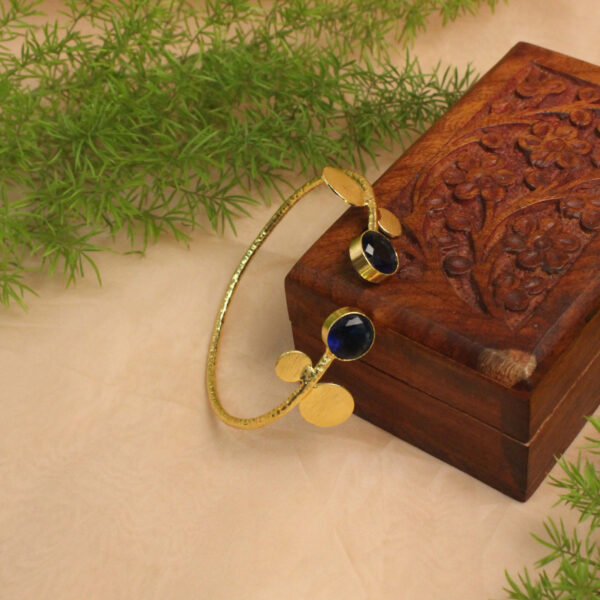 Gold polish bracelet studded with sparkling stones