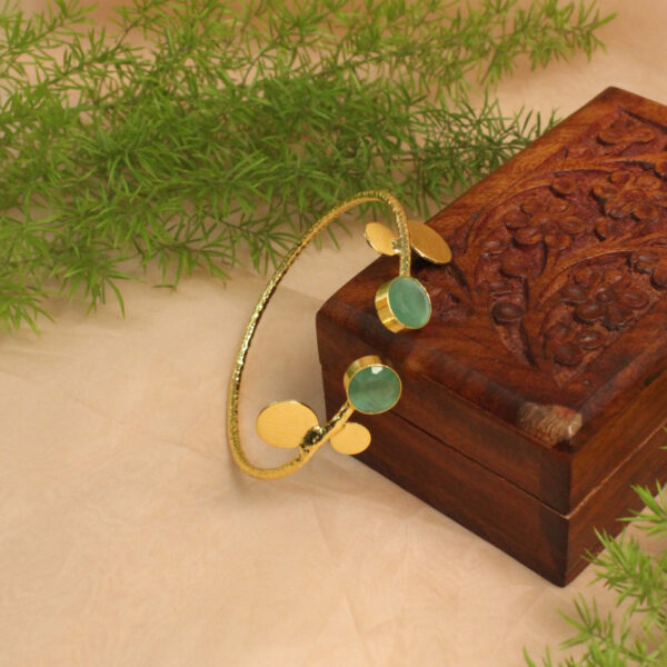 Gold polish bracelet studded with sparkling stones