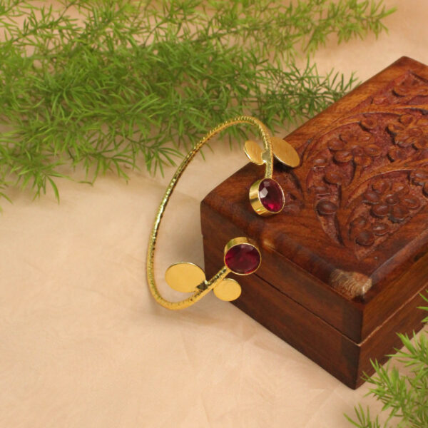 Gold polish bracelet studded with sparkling stones