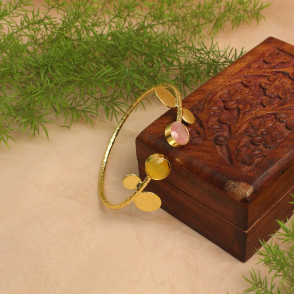 Gold polish bracelet studded with sparkling stones