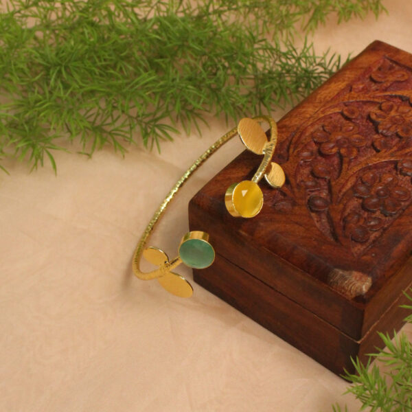Gold polish bracelet studded with sparkling stones