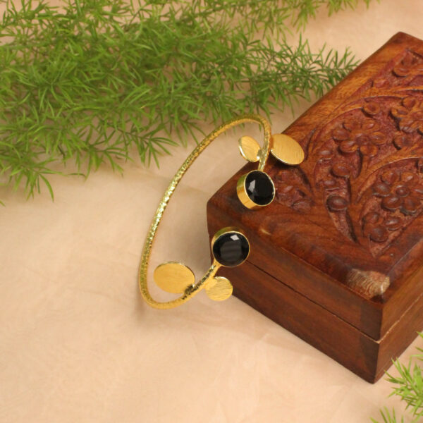 Gold polish bracelet studded with sparkling stones