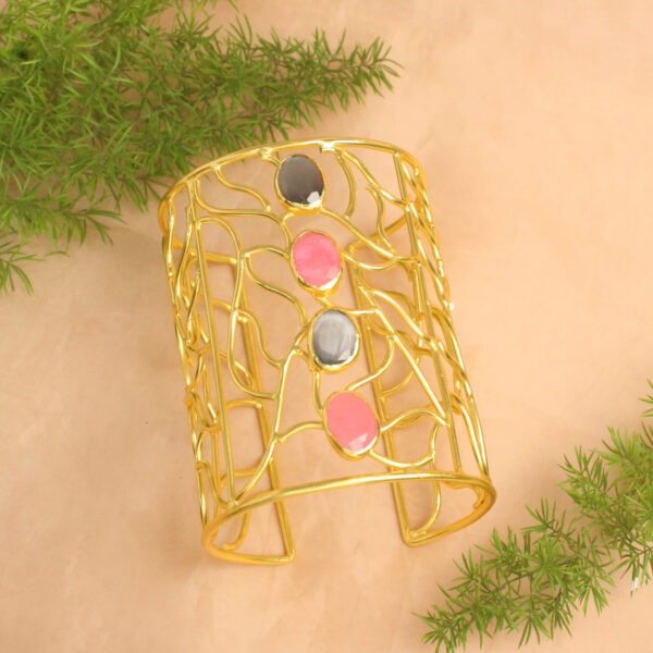 Gold polish handcuff studded with sparkling stones