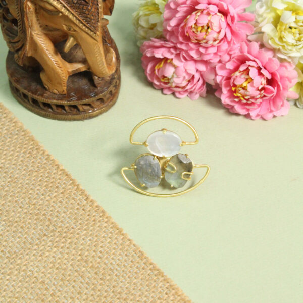 A handcrafted natural stone ring with a gemstone set in a minimalist band