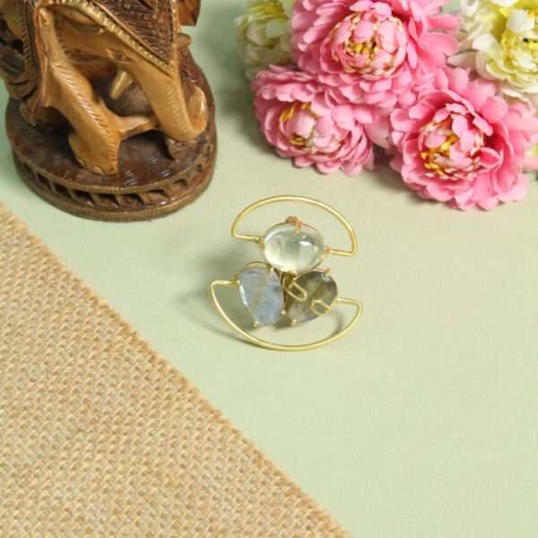 A handcrafted natural stone ring with a gemstone set in a minimalist band