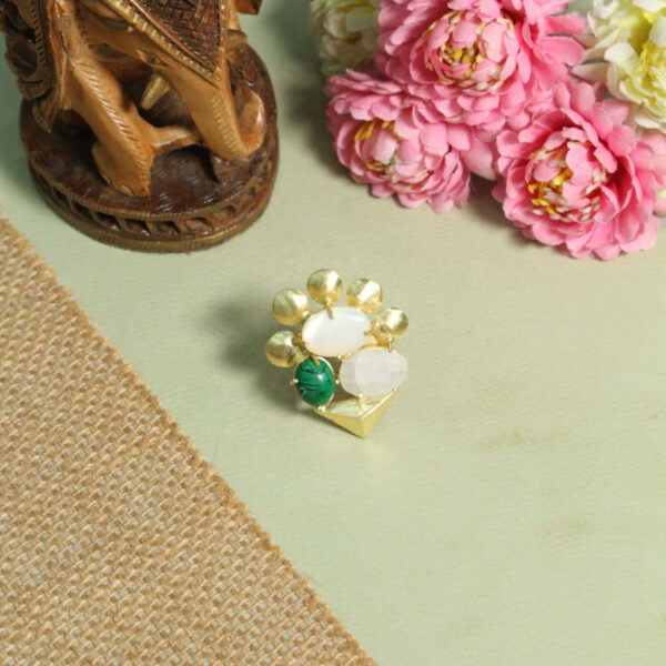 A handcrafted natural stone ring with a gemstone set in a minimalist band