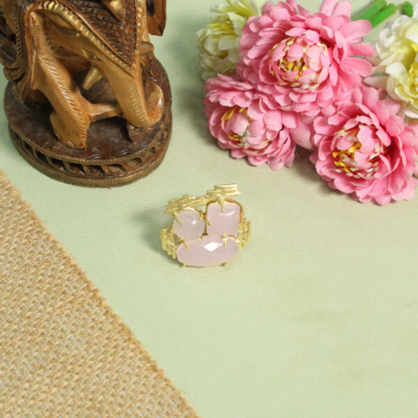 A handcrafted natural stone ring with a gemstone set in a minimalist band