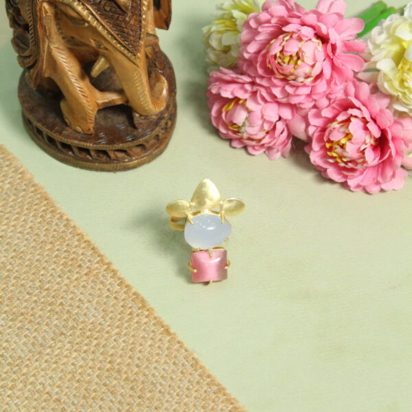 A handcrafted natural stone ring with a gemstone set in a minimalist band