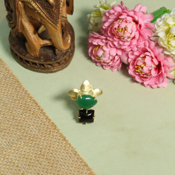 A handcrafted natural stone ring with a gemstone set in a minimalist band