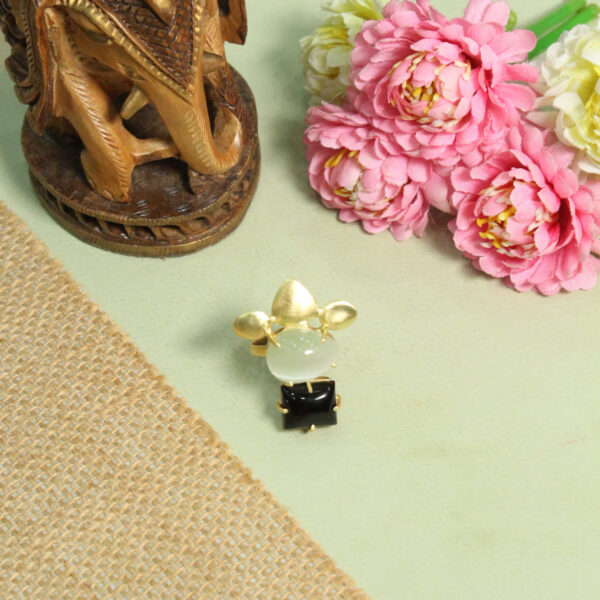 A handcrafted natural stone ring with a gemstone set in a minimalist band