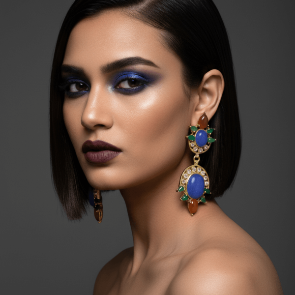 Belsi's Jewelry handcrafted gold-toned drop earrings with large lapis blue oval cabochons, emerald green marquise accents, and a terracotta teardrop base.