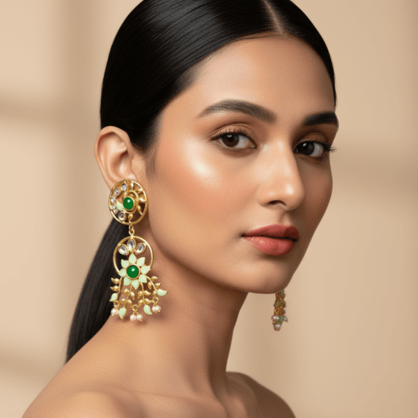 "Green enamel floral kundan drop earrings with pearl accents and gold detailing"