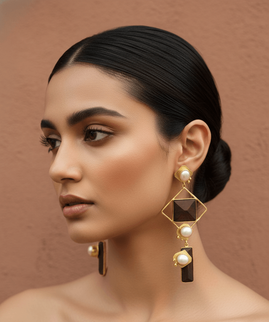 Handcrafted Rosewood and Baroque Pearl Tiered Rhombus Earrings 1 model wearing tiered architectural earrings featuring a gold rhombus frame, dark rosewood geometric accents, and lustrous white pearls.