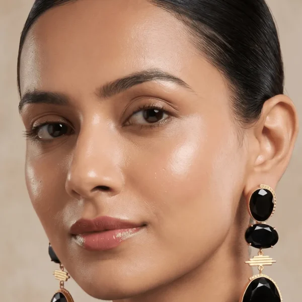 Belsi's Jewelry bold black onyx quartz three-tier statement drop earrings featuring handcrafted textured gold-plated borders.