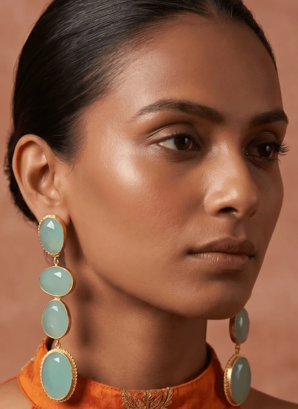 Seafoam Green Quartz Multi-Tier Drop Earrings 1 Belsi's Jewelry multi-tier statement drop earrings featuring four graduated, faceted seafoam mint green quartz stones encased in handcrafted gold-plated frames.