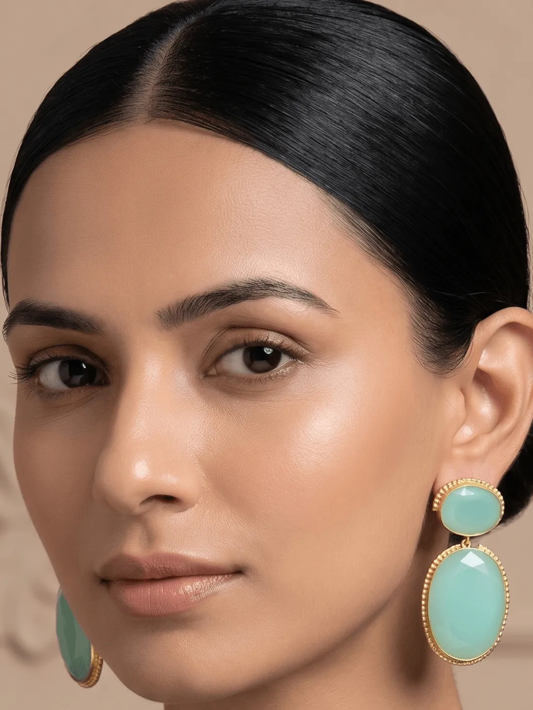 Mint Green Quartz Two-Tier Drop Earrings 1 Belsi's Jewelry two-tier statement drop earrings featuring an oval mint green quartz top stone and a larger, matching faceted mint green teardrop crystal encased in handcrafted gold-plated borders.