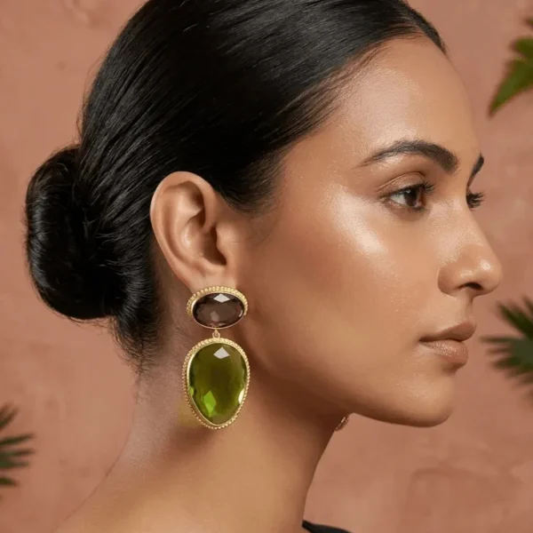 Belsi's Jewelry two-tier statement drop earrings featuring an oval amethyst purple quartz top stone and a large, faceted olive green teardrop crystal encased in handcrafted gold-plated borders.