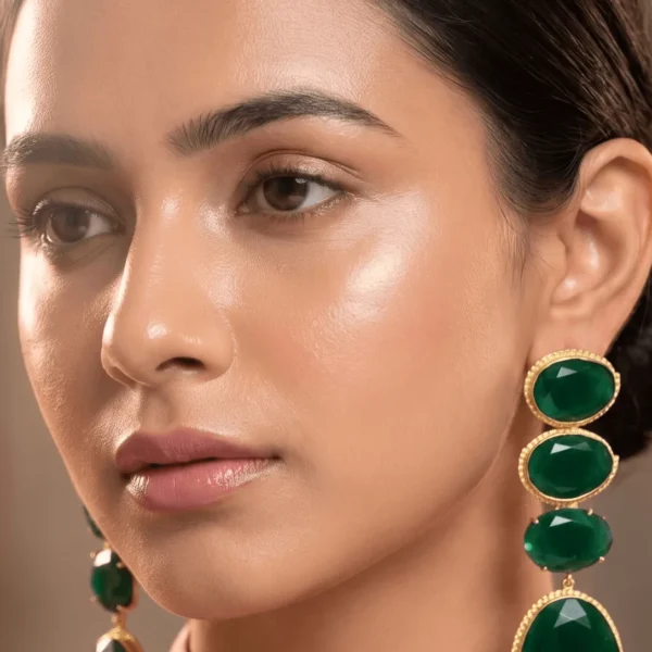 Belsi's Jewelry multi-tier linear statement drop earrings featuring four graduated, faceted deep emerald green quartz stones encased in handcrafted gold-plated frames.
